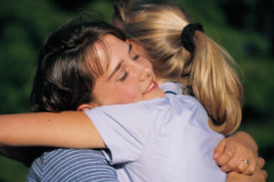 Visualise hugging and comforting yourself as you were back then, or hugging and comforting the child in the dream.